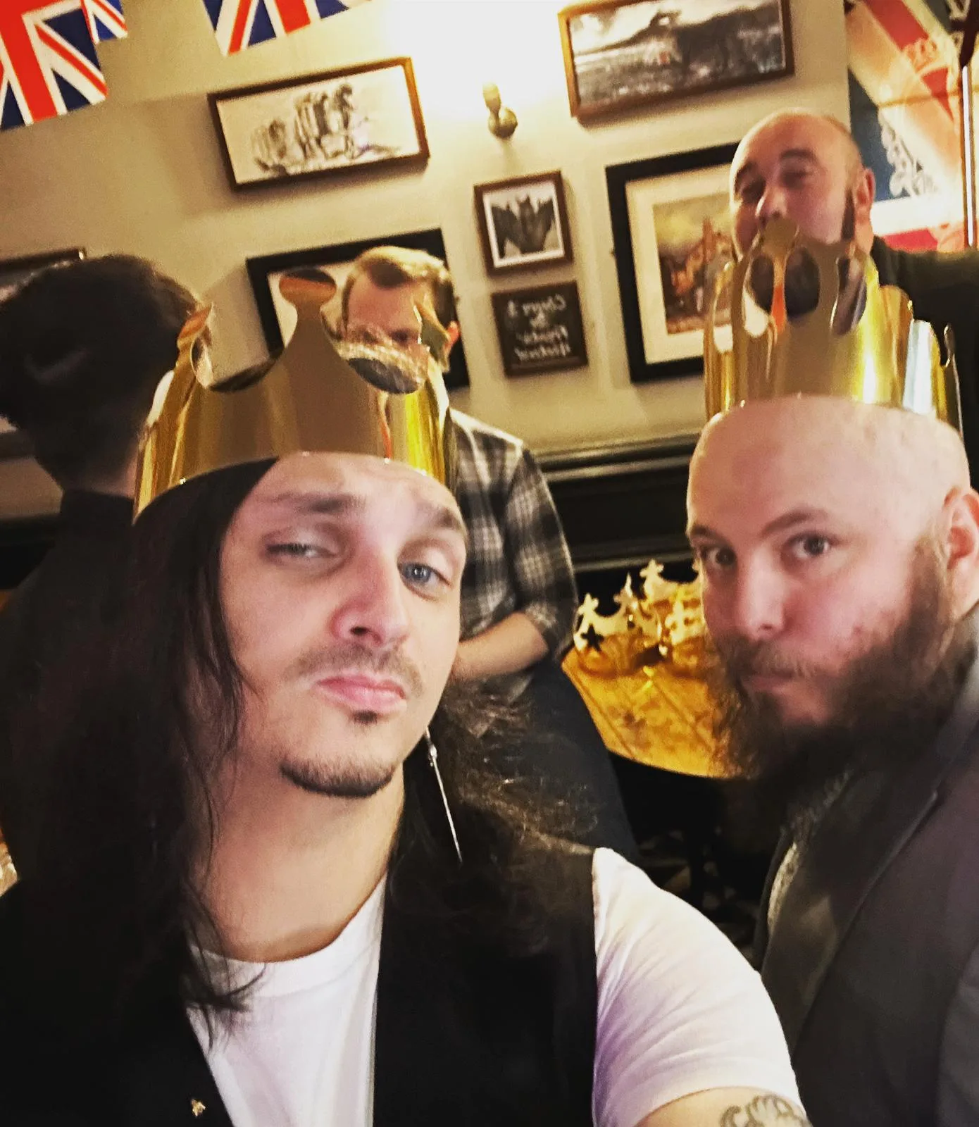 Two new Masons in paper crowns celebrating the coronation, as part of our 2023 Social Calendar